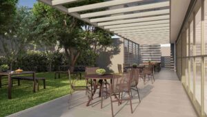 Terraço gourmet com parte no jardim com árvores e chão de gramas